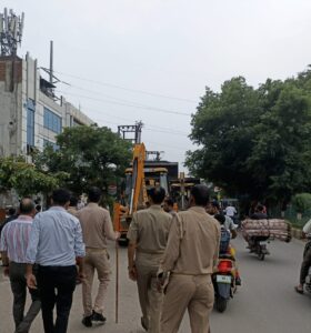 Ghaziabad development authority bulldozer in action 